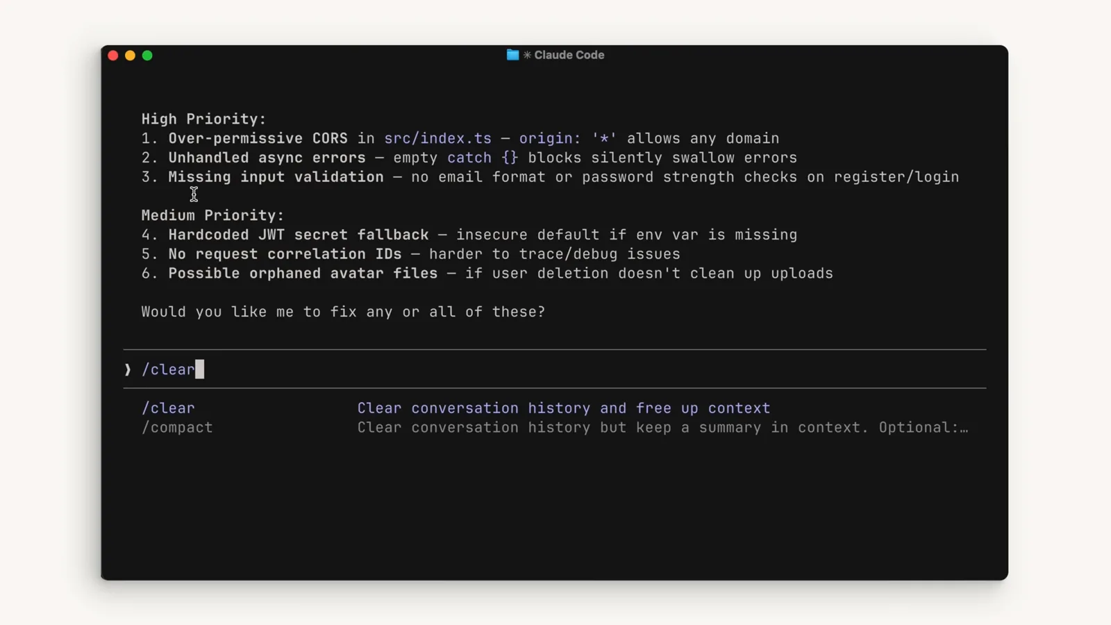 Claude Code terminal with the /clear command typed and its autocomplete description promising to clear conversation history and free up context