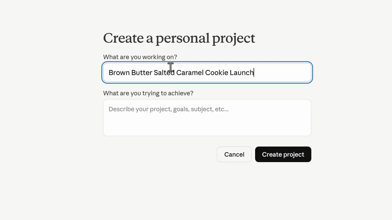 Claude Create a personal project dialog with Brown Butter Salted Caramel Cookie Launch typed under What are you working on? and an empty What are you trying to achieve? description field